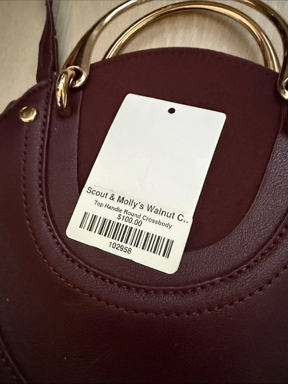 Round Crossbody Bag in Plum with Gold Accents